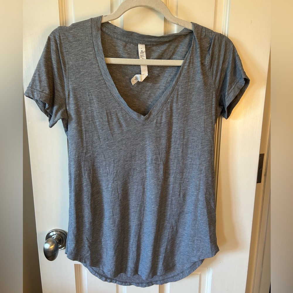 Gray lululemon T-shirt, barley worn, in perfect condition, size 4.